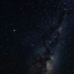 Celestial Rise: Dark Hill Under Nebula Wallpaper